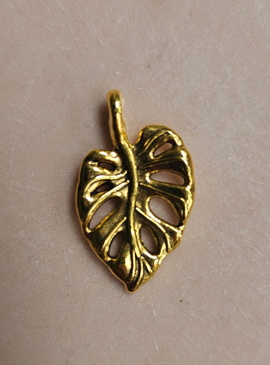 Antique gold monstera pendant