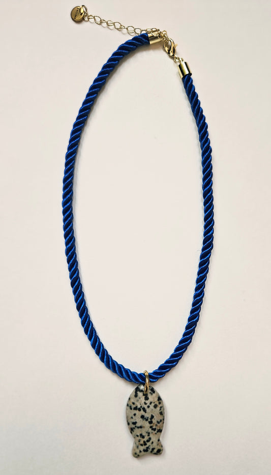 Blue rope necklace with a dalmation fish pendant.
