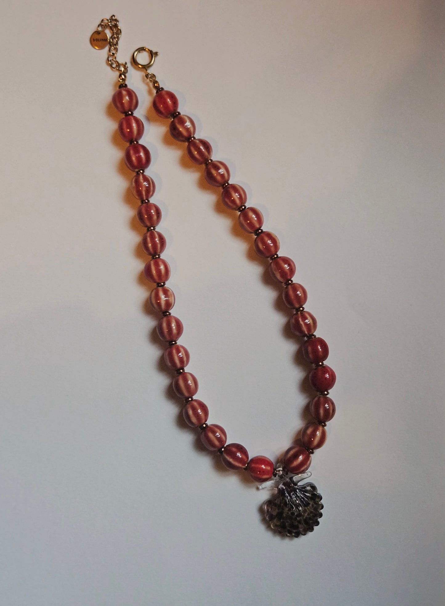 Brown glass shell pendant