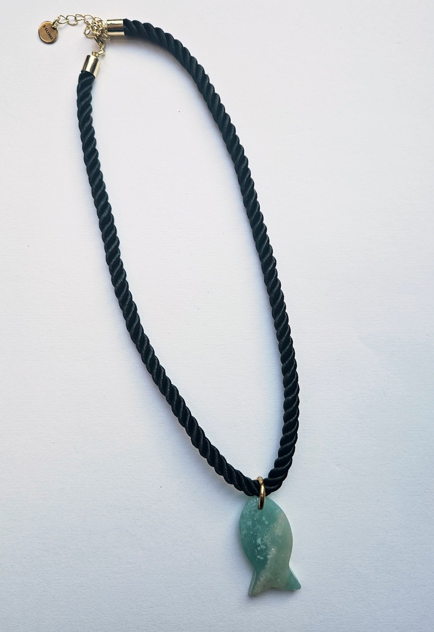 Amazonite fish pendant on a black silk cord necklace.