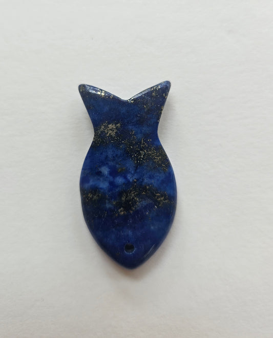 Blue fish-shaped pendant on a white background